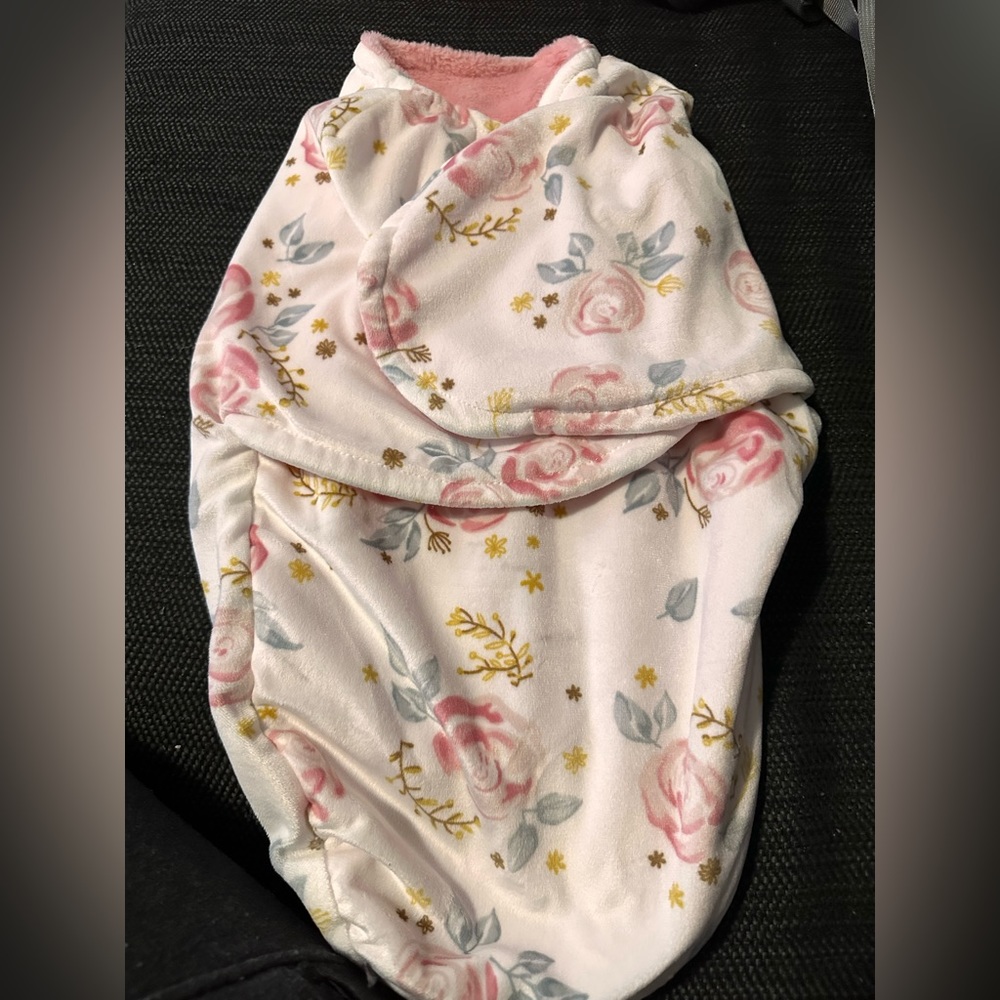 Floral swaddle. Never used. Only washed prior to having baby.